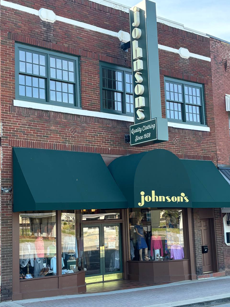 Johnson's Department Store on Tennessee Avenue, Downtown Etowah — brick storefront with green awnings and the classic vertical johnson's sign